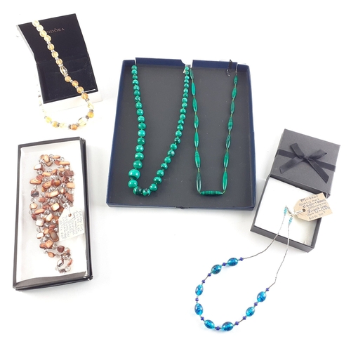 205 - A collection of coloured glass jewellery, to include a BLUE GLASS MURANO bracelet - to include TIGER... 