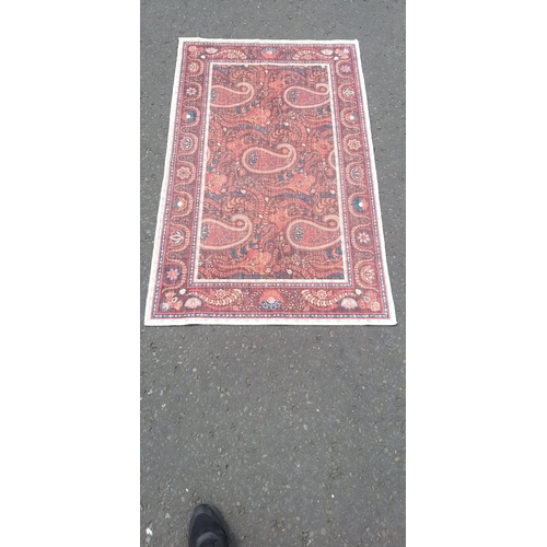 254 - A modern made PAISLEY pattern carpet 150cm x 90cm. A good usable piece.