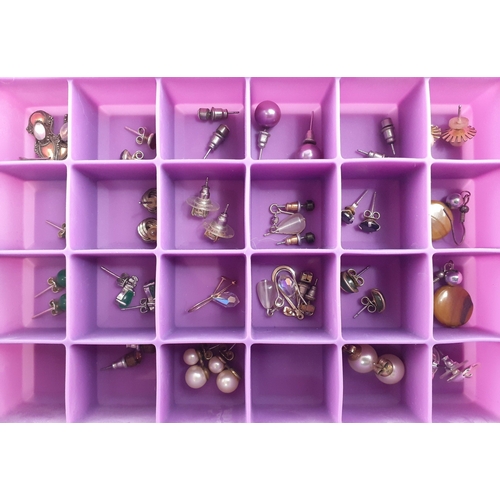 192 - A good collection of earrings in two storage boxes. Over twenty five pairs well stored.