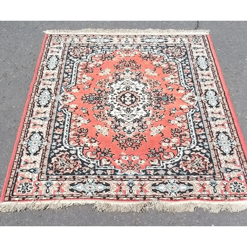253 - A PERSIAN hand-knotted carpet with traditional central medallion - the carpet is worn in areas but s... 