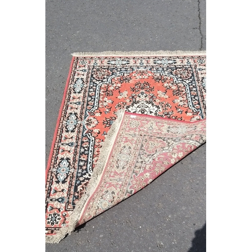 253 - A PERSIAN hand-knotted carpet with traditional central medallion - the carpet is worn in areas but s... 