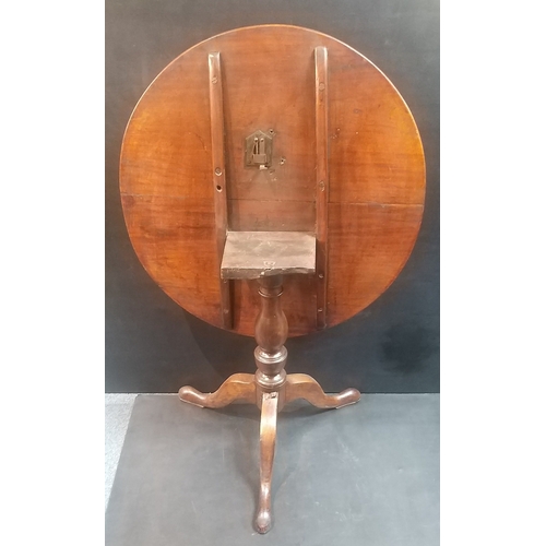 269 - Georgian mahogany tilt top table 75cm in diameter.  Good clean working condition. A classy piece.