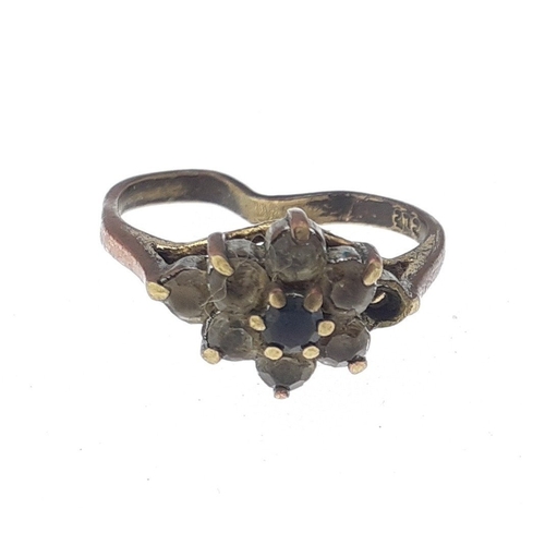 29 - A 375 stamped bent ring with faux diamonds. Gross weight 2g approx