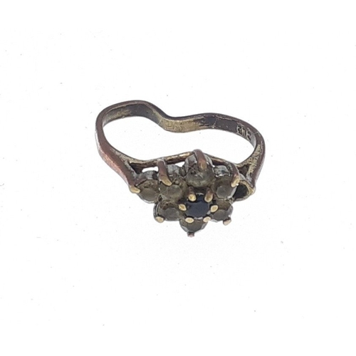 29 - A 375 stamped bent ring with faux diamonds. Gross weight 2g approx