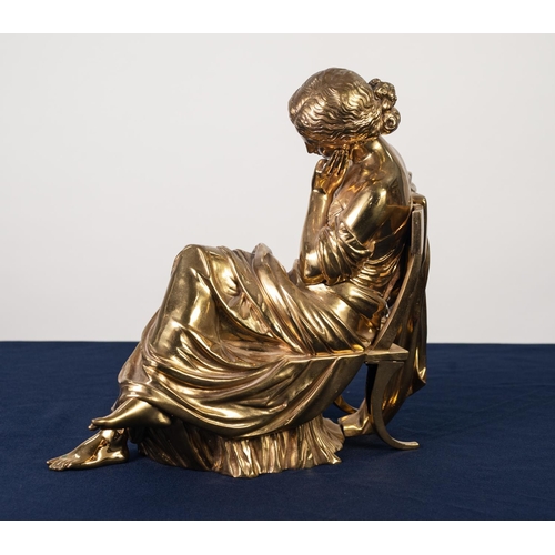 88A - VICTORIAN GOLD PATINATED BRONZE FEMALE FIGURE, modelled seated in pensive pose on a Regency chair, a... 