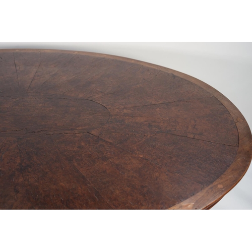 132 - EARLY NINETEENTH CENTURY FIGURED AND BURR WALNUT BREAKFAST TABLE, the moulded oval tilt-top with dia... 