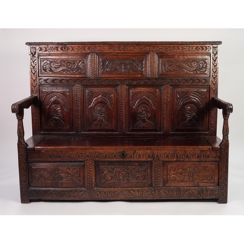 112 - PROBABLY FLEMISH, ANTIQUE AND LATER COMPOSITE CARVED OAK SETTLE, the back with seven fielded panels,... 