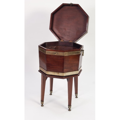 126 - GEORGE III BRASS BANDED MAHOGANY OCTAGONAL CELLARETTE, with metal lined interior, brass side handles... 