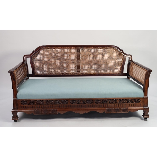 159 - EARLY TWENTIETH CENTURY CARVED MAHOGANY AND SINGLE CANED BERGERE SETTEE, the moulded flat top rail w... 