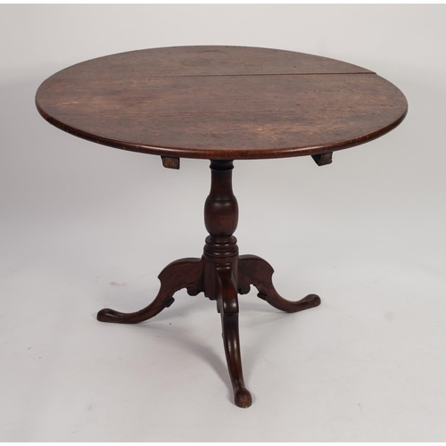 109 - GEORGIAN OAK TILT TOP OCCASIONAL TABLE, the circular top above a vase shaped, turned column, and rai... 