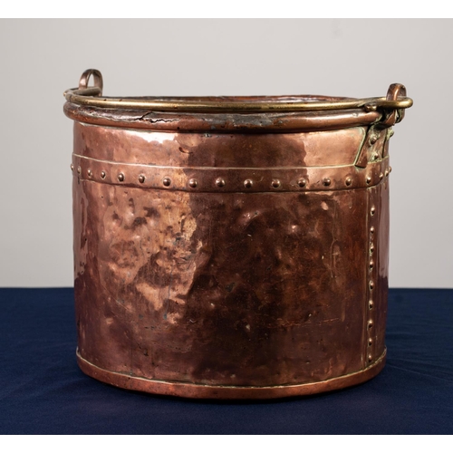 78 - ANTIQUE STUDDED COPPER COAL BUCKET, with brass swing handle, 10 ½” (26.7cm) high, 13” (33cm) diamete... 