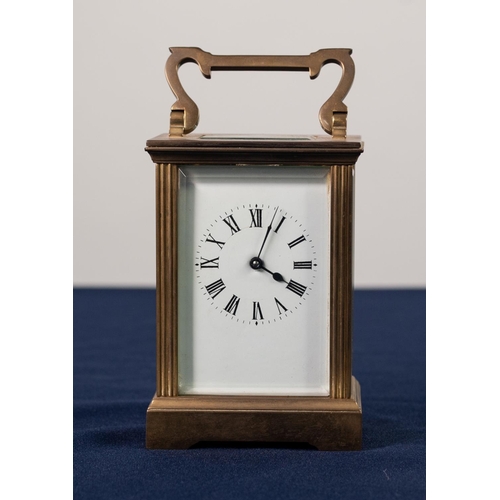 30 - EARLY TWENTIETH CENTURY FRENCH BRASS CASED CARRIAGE CLOCK, the enamelled Roman dial powered by a spr... 