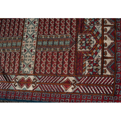 1 - EASTERN FLAT WEAVE BORDERED RUG with intricate four panel design with a repeated pattern in rows on ... 