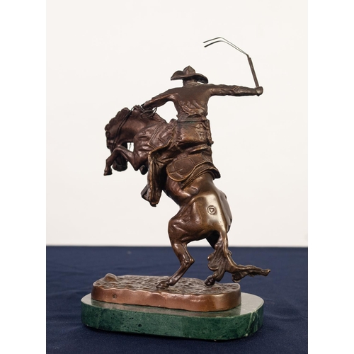 82 - AFTER FREDERICK REMMINGTON, BRONZE GROUP, ‘BRONCO BUSTER’, modelled as a cowboy with whip on a reari... 