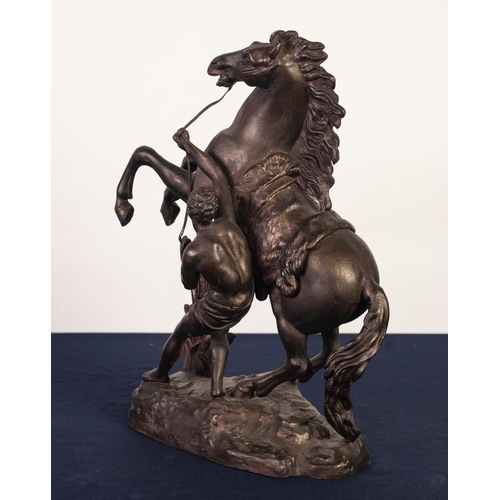 83 - MARLEY HORSE, CAST SPELTER GROUP, dark patination with gilt dusted highlights, 16” (40.7cm) high