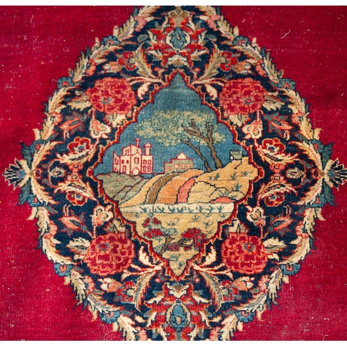 17 - KIRMAN PERSIAN RUG, the large lozenge shaped medallion with pendants and decorated in a central pict... 