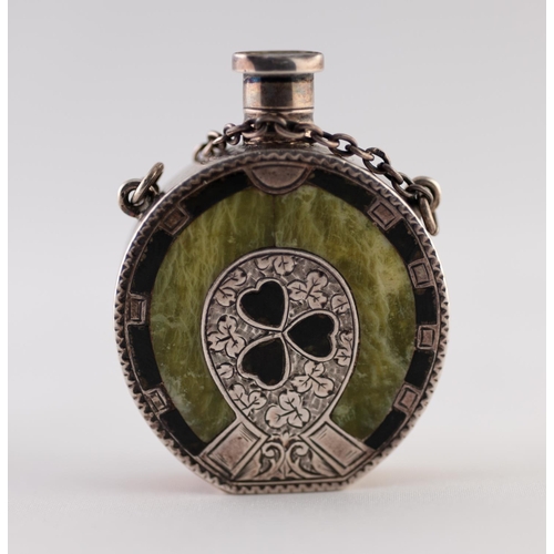 25 - AN EDWARDIAN SILVER GREEN-STONE INSET AND BLACK JAPANNED HORSE-SHOE SHAPED SCENT FLASK, centred with... 