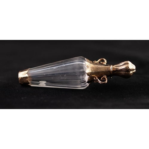 21 - A LATE 19TH CENTURY FRENCH FACETED CLEAR GLASS AND GOLD COLOURED METAL MOUNTED SCENT BOTTLE