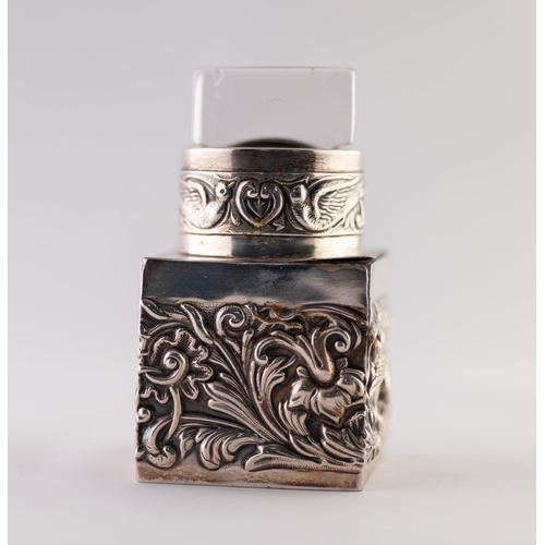 12 - A LATE VICTORIAN SILVER INCASED PRESSED GLASS SCENT BOTTLE, stamped with birds amongst floriated scr... 