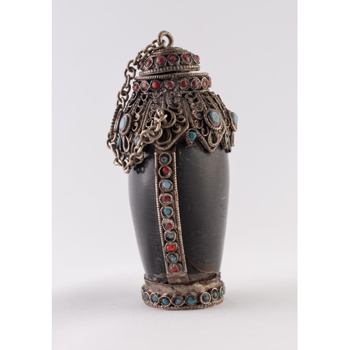 35 - A POSSIBLY HORN, WHITE METAL AND FAUX JEWEL ENCRUSTED SNUFF BOTTLE, with chain attached stopper and ... 