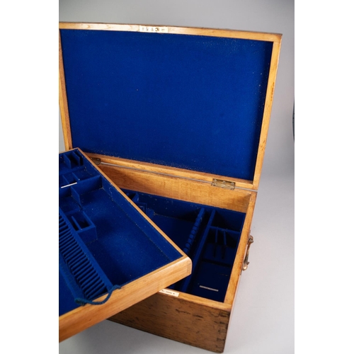 747 - AN OAK CANTEEN LINED WITH ROYAL BLUE VELOUR with a removable tray, inset with bone tablets inscribed... 