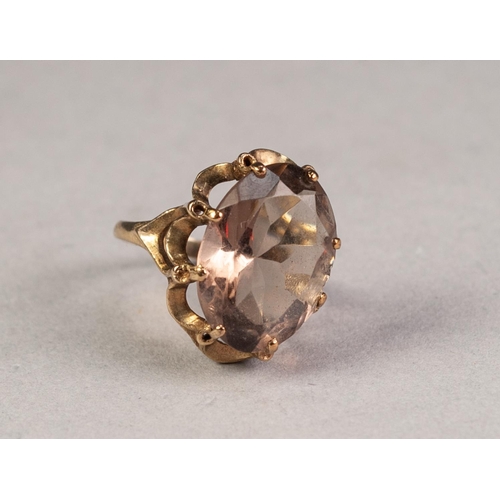 318 - 9ct GOLD DRESS RING, with large oval smoky quartz in a fancy eight claw crown setting, 4.6gms, ring ... 