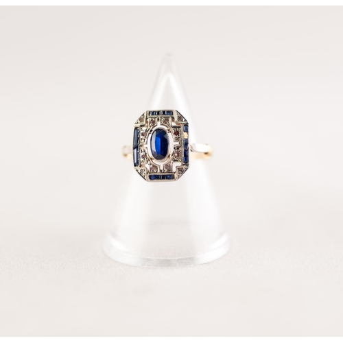 367 - EDWARDIAN SAPPHIRE AND DIAMOND PLAQUE RING. An oval cut sapphire within a pierced plaque set with si... 