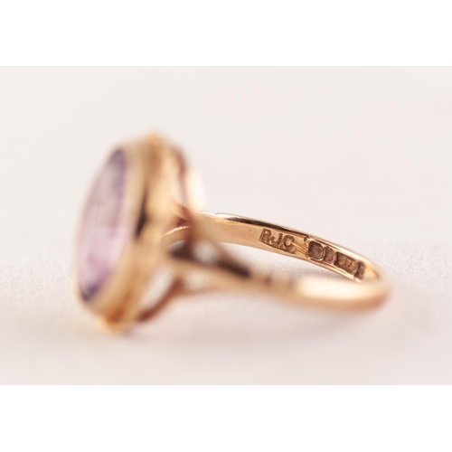 368 - 9ct GOLD AMETHYSY RING. Oval amethyst in a rope frame, to forked shoulders, ring size K1/2, 3.24g