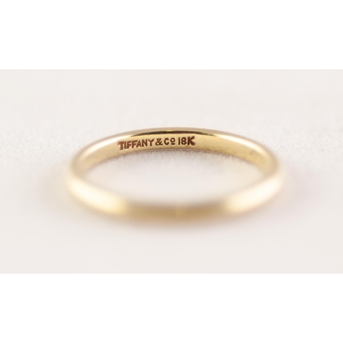 369 - TIFFANY & CO BAND RING. Stamped '18K', ring size J, 1.98g