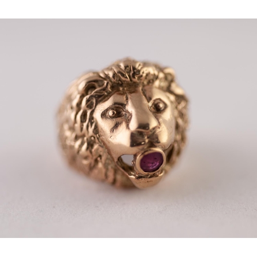 264L - 9ct GOLD RUBY LION HEAD RING. Cast as a lion head with a round ruby in the mouth, ring size P1/2, 17... 