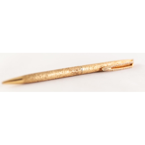 260H - 18ct GOLD AND DIAMOND BALL POINT PEN, with textured barrel and diamond set clip, total estimated dia... 