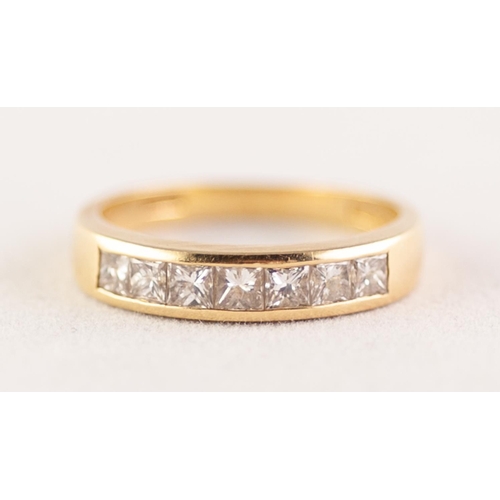 276 - 18 ct GOLD BAND RING the top set with a row of seven square cut diamonds, approximately 3/4 ct in to... 