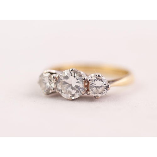 280 - 18ct GOLD RING CLAW SET WITH THREE ROUND BRILLIANT CUT DIAMONDS the centre diamond approximately 0.7... 