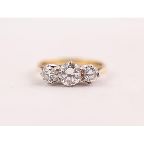 280 - 18ct GOLD RING CLAW SET WITH THREE ROUND BRILLIANT CUT DIAMONDS the centre diamond approximately 0.7... 