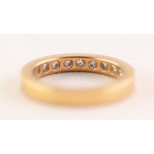 282 - 18 ct GOLD AND DIAMOND ETERNITY RING the straight sided band gypsy set on the inside of the band wit... 