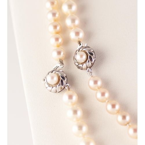 302 - TWO SINGLE STRAND NECKLACES OF UNIFORM IMITATIONS PEARLS, with matching silver clasps, 40