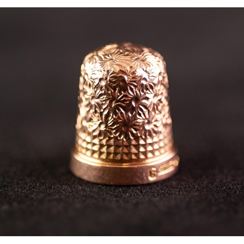 257 - POST WAR 9ct GOLD THIMBLE size 8, Birmingham 1967, 5 gms in an EGG SHAPED BLACK LEATHER AND GILT MET... 