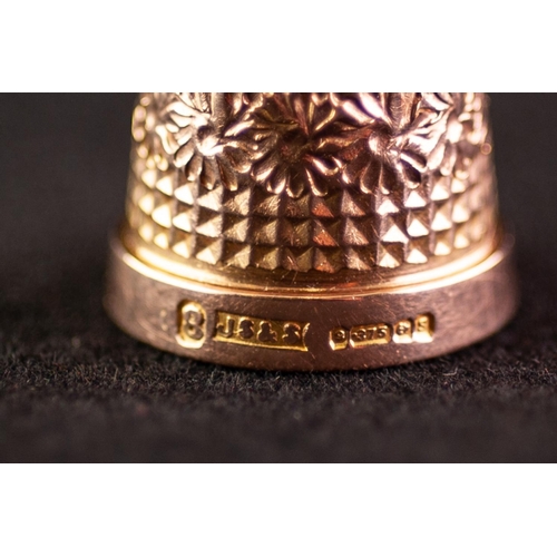 257 - POST WAR 9ct GOLD THIMBLE size 8, Birmingham 1967, 5 gms in an EGG SHAPED BLACK LEATHER AND GILT MET... 