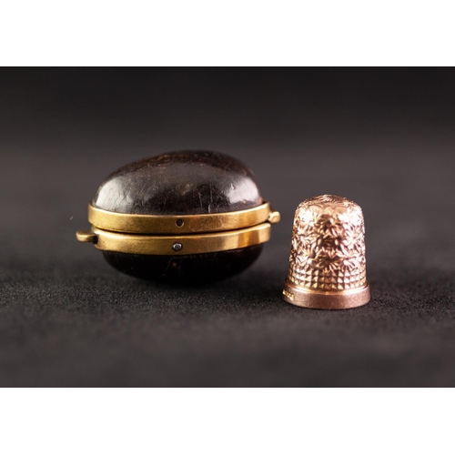 257 - POST WAR 9ct GOLD THIMBLE size 8, Birmingham 1967, 5 gms in an EGG SHAPED BLACK LEATHER AND GILT MET... 