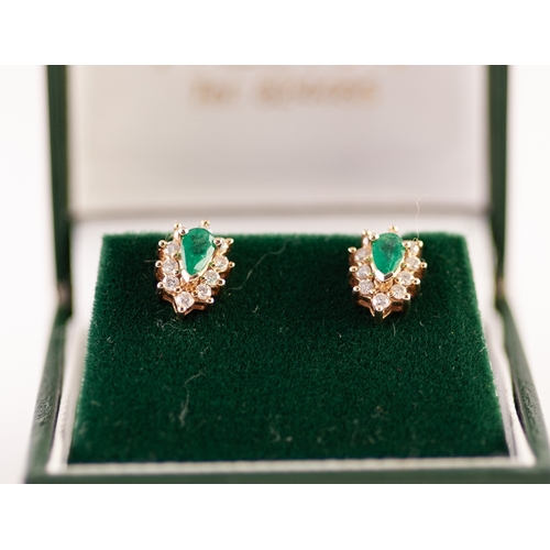 305 - A PAIR OF 14ct  (585) stamped TINY EMERALD AND DIAMOND SET EAR STUDS