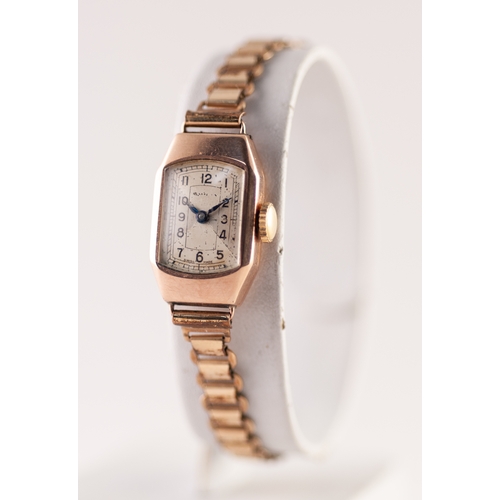 334 - LADY'S SWISS 9ct GOLD WRISTWATCH with 15 jewels movement, narrow oblong silvered Arabic cial and the... 