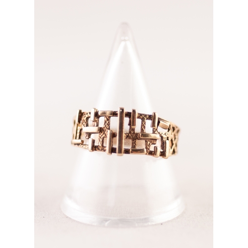 356 - GOLD COLOURED METAL RING WITH RANDOM PATTERN BROAD PIERCED AND EMBOSSED TOP, resllis pierced shoulde... 