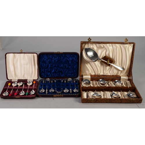 749 - A CASED SET OF SIX PLATED TEASDPOONS, with matching  SUGAR TONGS, with figure terminals, a  CASED SE... 