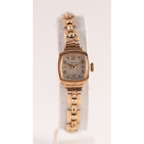 114 - LADY'S AVIA 9ct GOLD WRIST WATCH, with mechanical movement, small square silvered Arabic dial, small... 