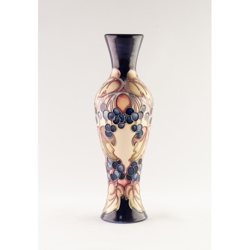 53 - MODERN MOORCROFT ARTIST SIGNED TUBE LINED POTTERY VASE, of slender, waisted oviform, decorated in co... 