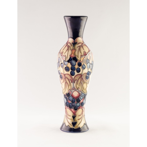 53 - MODERN MOORCROFT ARTIST SIGNED TUBE LINED POTTERY VASE, of slender, waisted oviform, decorated in co... 
