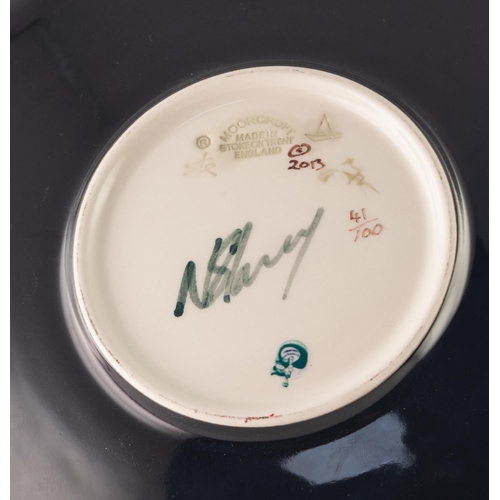 41 - MODERN MOORCROFT ARTIST SIGNED LIMITED EDITION TUBE LINED POTTERY CIRCULAR PLAQUE, of slightly dishe... 