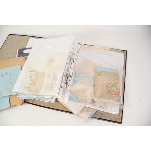 178 - BLACK FOLDER CONTAINING ENVELOPES OF LOOSE STAMPS, held within plastic sleeves