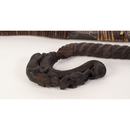 227 - *AGED INDIAN CARVED DARK HARDWOOD SCEPTRE, the crook form top carved with a tiger attacking a man's ... 