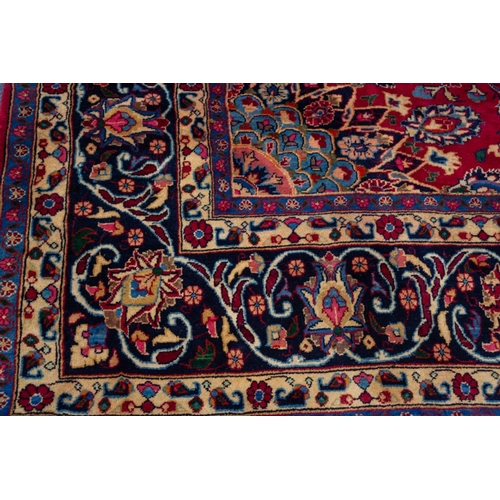 6 - MESHED PERSIAN CARPET with floral and petal shaped circular centre medallion with pendants and match... 